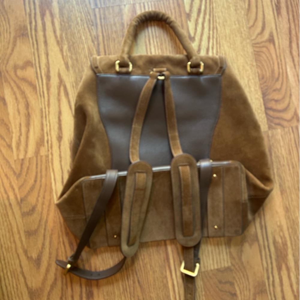 Brown Leather Backpack with Rugged Design and Multiple Compartments